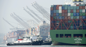 Trade observers predict reducing the backlog of containers on the West Coast docks will take many weeks.