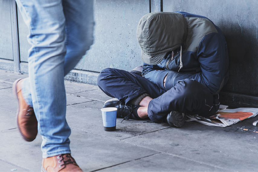 Homeless person on sidewalk