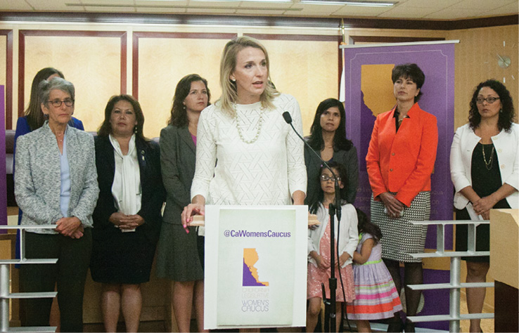 CalChamber Policy Advocate Jennifer Barrera explains CalChamber support for the gender equity pay bill, SB 358 by Senator Hannah-Beth Jackson (D-Santa Barbara; standing at left), at a State Capitol news conference. 